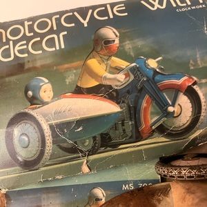 Vintage toy motorcycle with sidecar